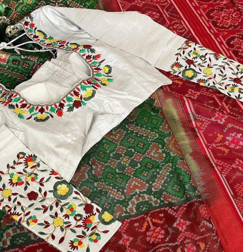 White linen blouse with traditional dark grey - red pattern