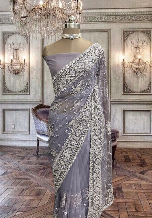 Beautiful Light Violet Colour Net Saree with Zari and Stone Work