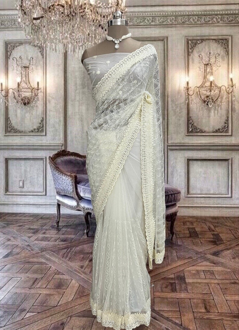 Beautiful Cream Colour Net Saree with Sequin Work
