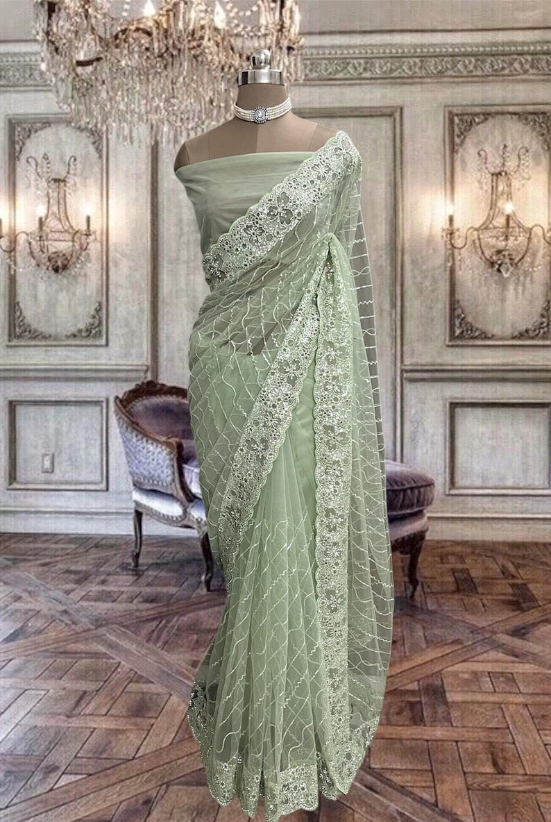 Beautiful Pastel Green Net Saree with Sequins Work