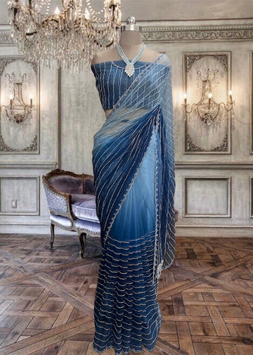 Beautiful Blue Shaded Hand Embroidered Net saree