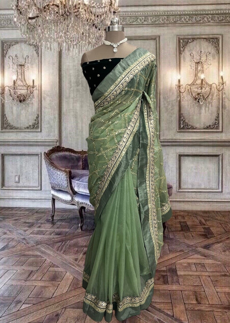 Beautiful Dull Green Organza Saree with Broad Laces
